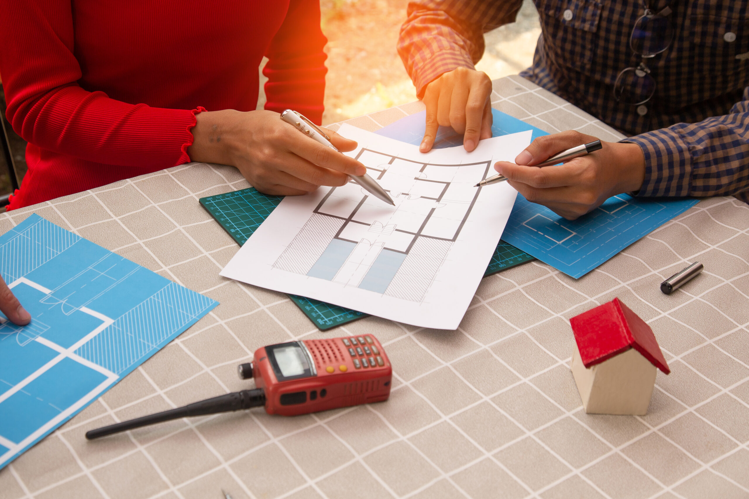 Home concept team architect inspect the project design with blueprint